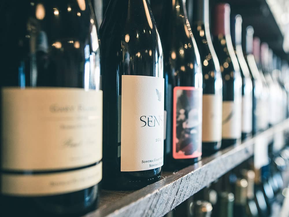 scott-warman-h4AGlo55tTA-unsplash Wine bottle