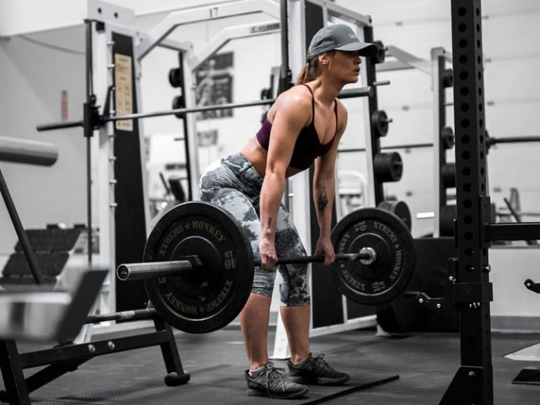 A woman doing deadlifts